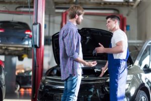 Mechanic_Repairs_With_Customer