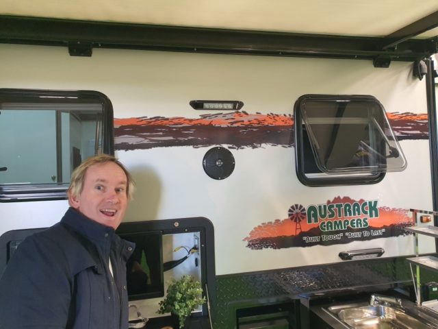 Business owner of Austrack Campers smiling for camera.