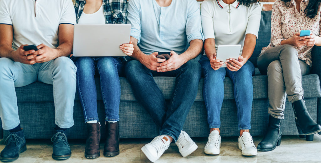 Young people engaging with social media content 